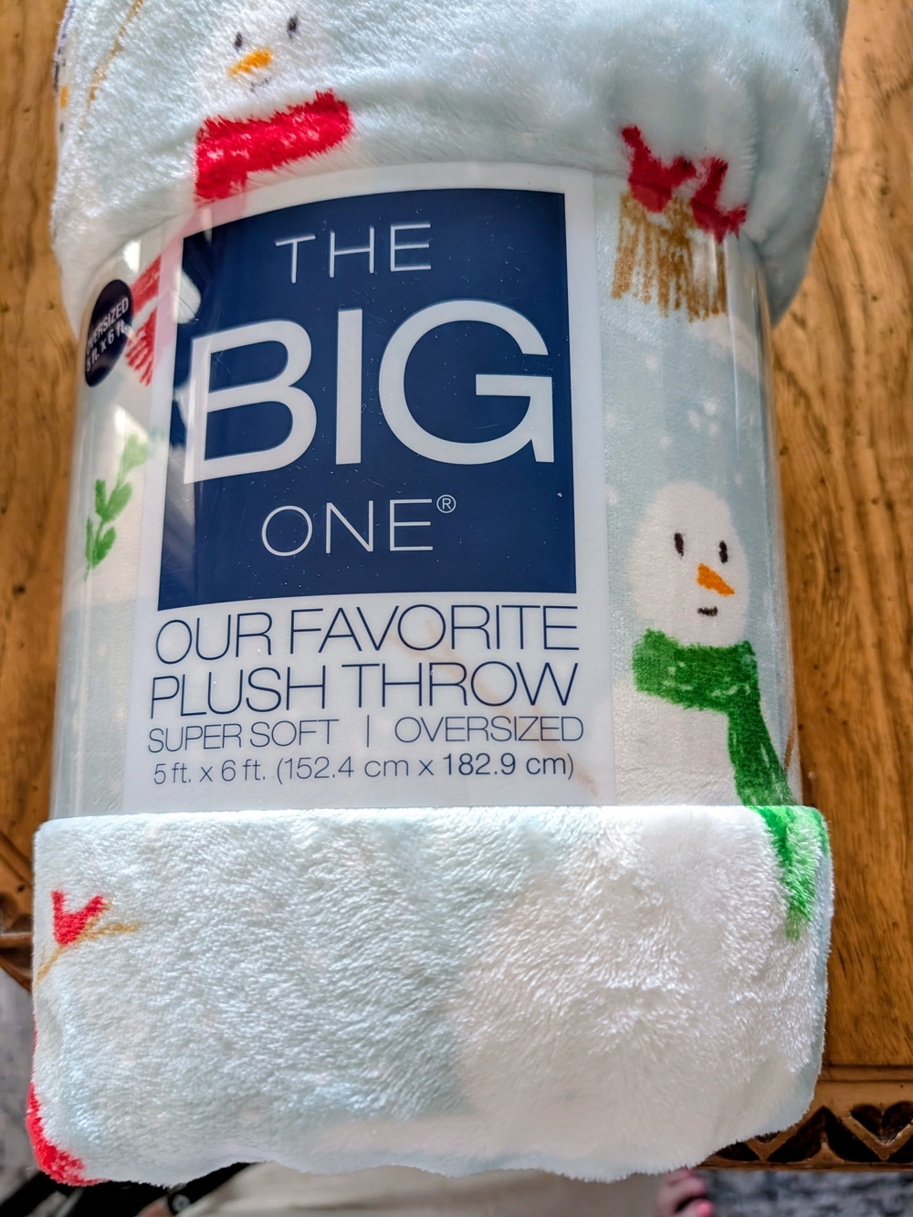 The Big One Light Blue Snowman Plush Throw with Red and Green Accents